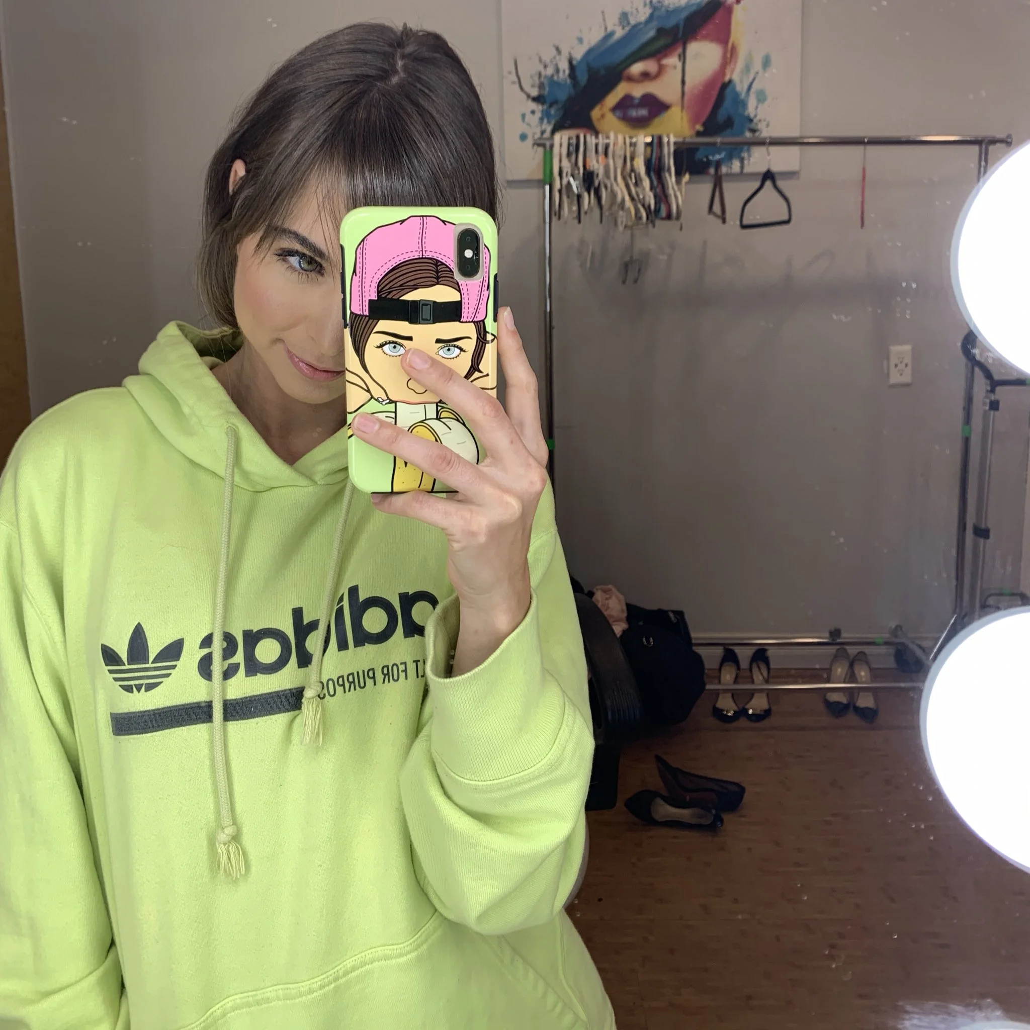 Riley (@rileyreidx3) Onlyfans model wearing a nice mint green adidas hoodie in her room